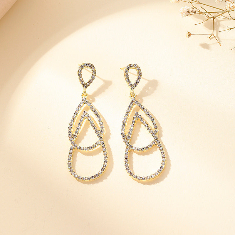 Exquisitos pendientes largos con borlas y gotas de agua de doble capa con temperamento de moda, diseño de nicho, pendientes de sensación de alta gama