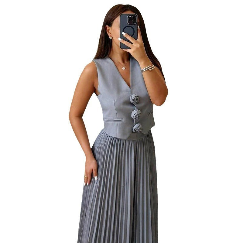 Elegante chaleco sin mangas con estampado floral y falda plisada