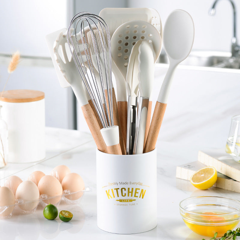 Juego de utensilios de cocina de silicona con mango de madera blanco cremoso