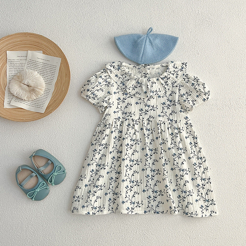 Vestido de niña pequeño con estampado floral y personalidad de moda