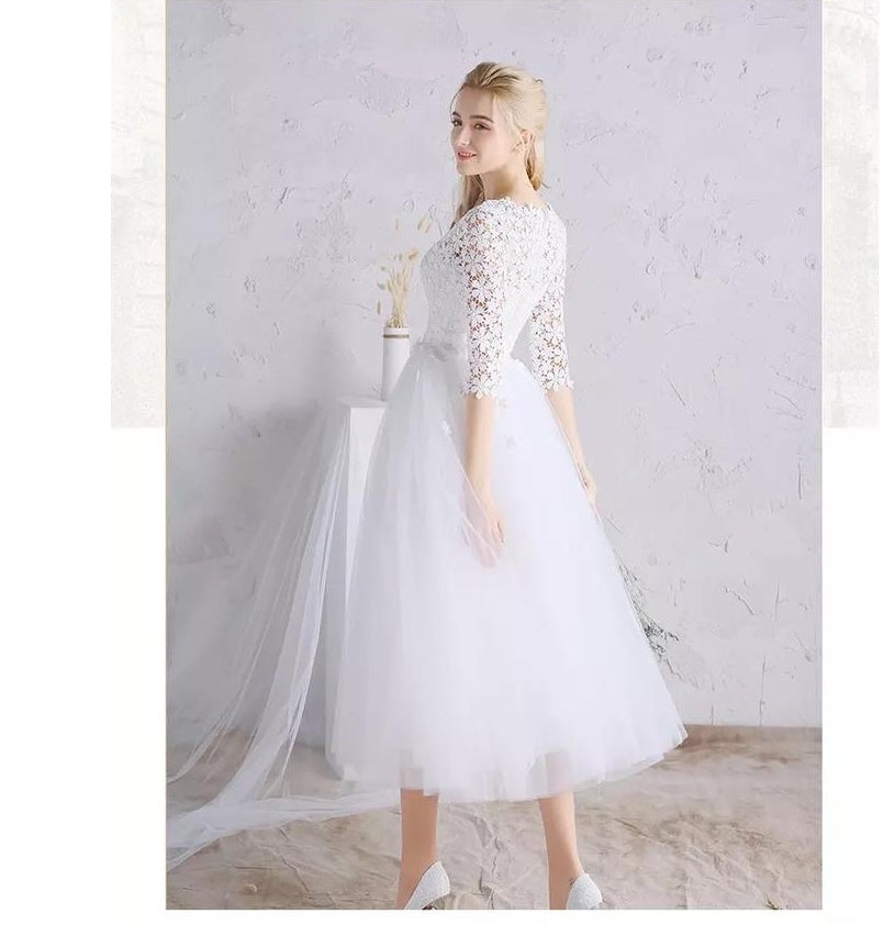 Vestido de novia blanco con falda abullonada