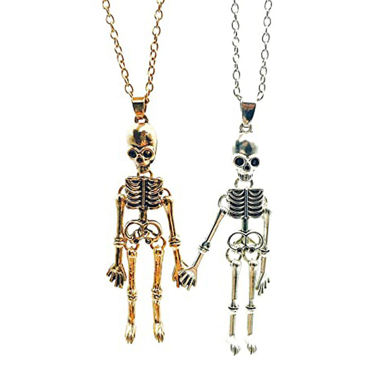 Collier vintage crâne fantôme main dans la main