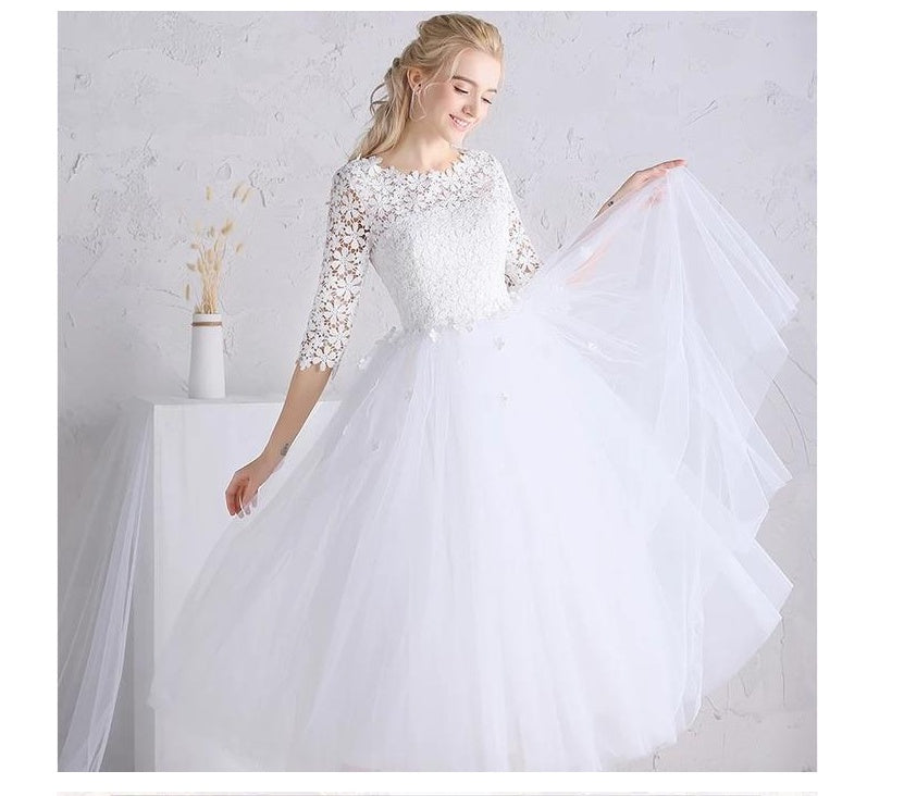 Vestido de novia blanco con falda abullonada