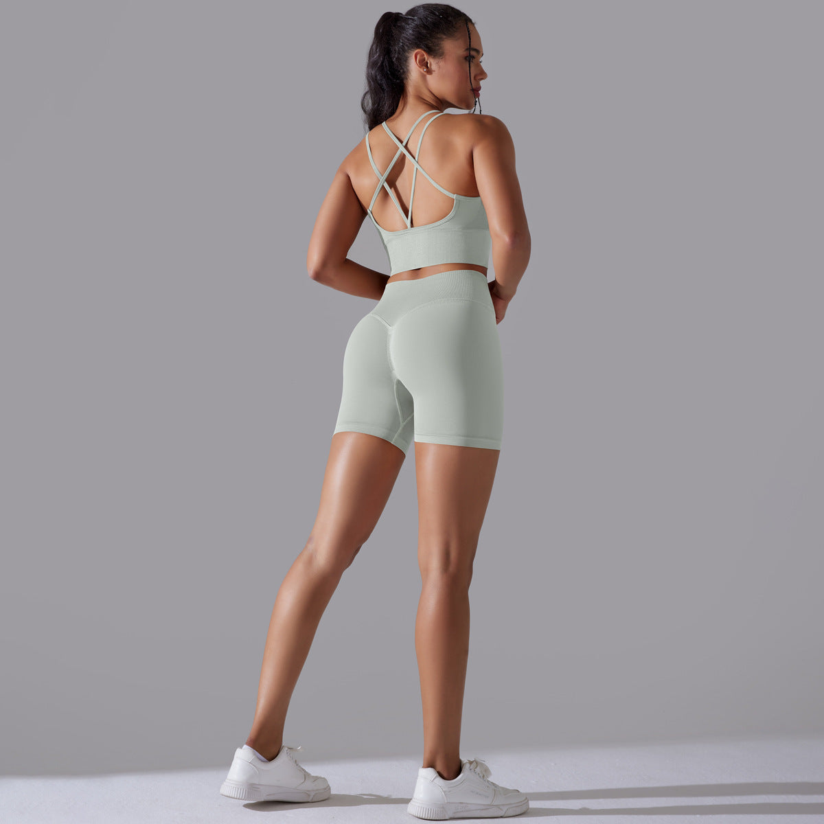 Traje de yoga ajustado deportivo de alta elasticidad con espalda de belleza de color sólido de punto sin costuras