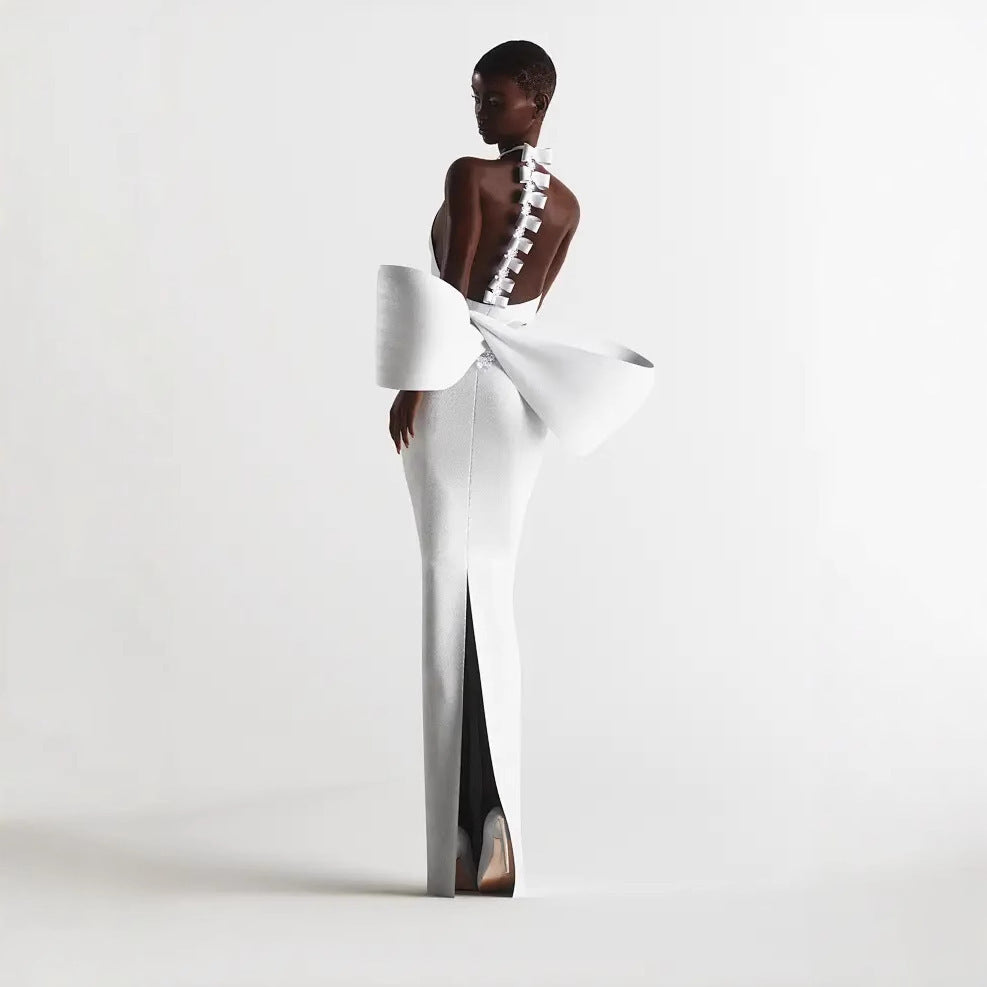Robe une pièce moulante à gros nœud et couleur unie