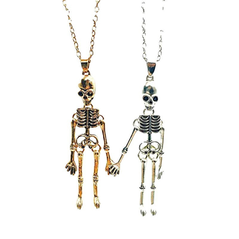 Collier vintage crâne fantôme main dans la main