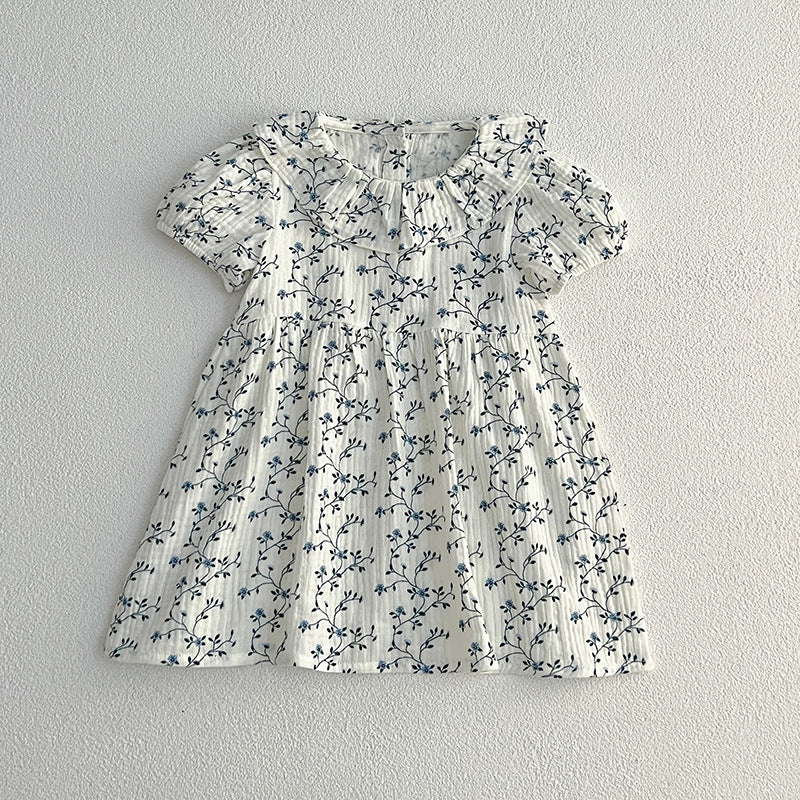 Vestido de niña pequeño con estampado floral y personalidad de moda